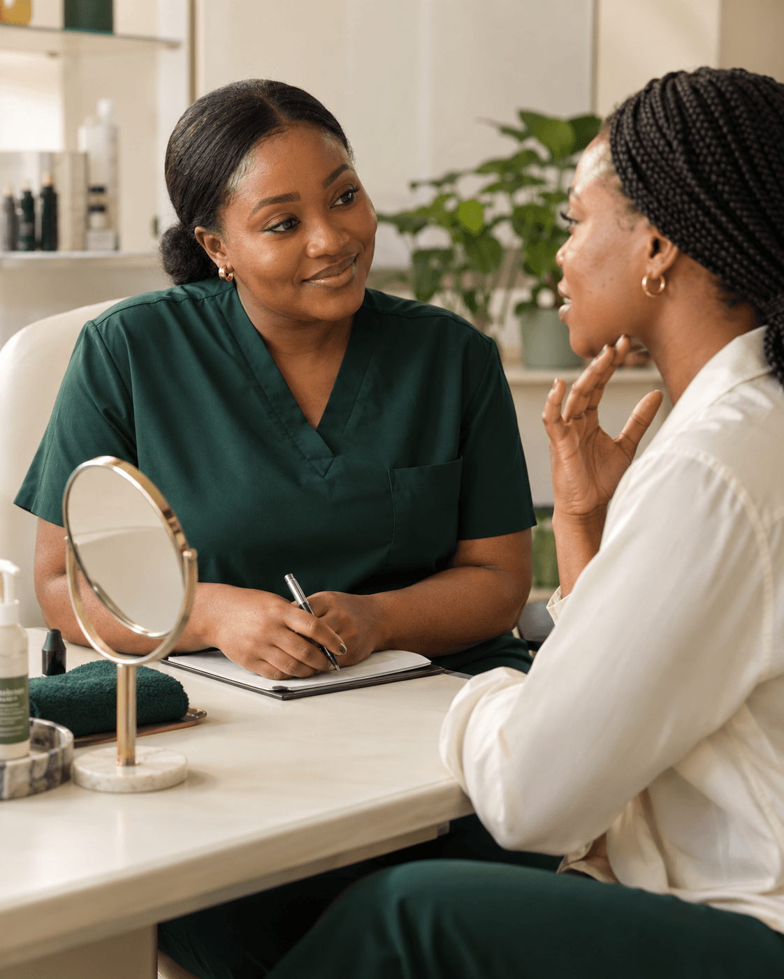 Illustrative consultation: a skincare practitioner listening to a client